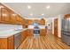 Spacious kitchen equipped with modern appliances, wooden cabinets, ample counter space, and sleek flooring at 1014 Academy Dr., Conway, SC 29526