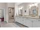 Stylish bathroom featuring dual sinks, marble countertops, and a spacious shower at 1033 Tuckers Rd., Pawleys Island, SC 29585