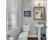 Charming powder room with a pedestal sink and decorative mirror at 1033 Tuckers Rd., Pawleys Island, SC 29585