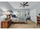 Spacious bedroom with light blue walls, carpeted floor and queen bed with an exit to the balcony at 1033 Tuckers Rd., Pawleys Island, SC 29585