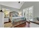 Cozy bedroom with large windows providing natural light at 1033 Tuckers Rd., Pawleys Island, SC 29585