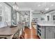 Dining area with wood floors, modern lighting, and seamless flow into the living room at 1033 Tuckers Rd., Pawleys Island, SC 29585