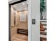Home elevator with wooden floor, bench and neutral walls, enhancing accessibility at 1033 Tuckers Rd., Pawleys Island, SC 29585