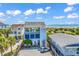 Three-story beach house with stunning ocean views, multiple parking spots, and palm trees at 1033 Tuckers Rd., Pawleys Island, SC 29585