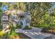 Charming two-story home with a well-manicured lawn and lush landscaping at 1033 Tuckers Rd., Pawleys Island, SC 29585