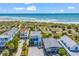 Aerial view showing a three-story beach house with ocean access across a beach boardwalk at 1033 Tuckers Rd., Pawleys Island, SC 29585