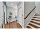 Hallway with stairway, wood floors, seating nook, and stylish decor at 1033 Tuckers Rd., Pawleys Island, SC 29585