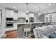 Stylish kitchen with white cabinetry, stainless steel appliances, and a breakfast bar at 1033 Tuckers Rd., Pawleys Island, SC 29585