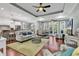 Open-concept living room with wood floors, modern furniture, and a cozy swing at 1033 Tuckers Rd., Pawleys Island, SC 29585
