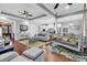 Spacious living room with a swing, hardwood floors, modern lighting, and an open view of the kitchen at 1033 Tuckers Rd., Pawleys Island, SC 29585