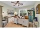Home office with large desk, built-in cabinets, neutral carpet and a window overlooking greenery at 1033 Tuckers Rd., Pawleys Island, SC 29585