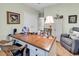 Spacious home office with a large desk, comfortable chair, and a serene atmosphere at 1033 Tuckers Rd., Pawleys Island, SC 29585
