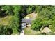 Aerial view of a home nestled among lush trees with a driveway leading to the home at 107 Azalea Dr., Conway, SC 29526