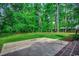 Large backyard with lush green grass and mature trees at 107 Azalea Dr., Conway, SC 29526