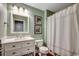 Bathroom with white vanity, framed art, and tiled shower/tub combo at 107 Azalea Dr., Conway, SC 29526