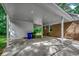 Attached carport with brick walls, recessed lighting, and access to the home's exterior and backyard at 107 Azalea Dr., Conway, SC 29526