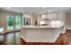 Modern kitchen with stainless steel appliances, white cabinets, and a breakfast bar at 107 Azalea Dr., Conway, SC 29526