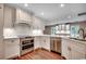 Bright kitchen with stainless steel appliances, granite countertops, and hardwood flooring at 107 Azalea Dr., Conway, SC 29526