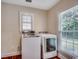 Well-lit laundry room with washer, dryer, and natural light from the windows at 107 Azalea Dr., Conway, SC 29526