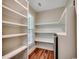 Bright pantry with natural light, wood floors, and ample shelving space at 107 Azalea Dr., Conway, SC 29526