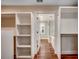 Walk-in closet with wood floors, custom shelving and storage systems at 107 Azalea Dr., Conway, SC 29526