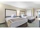 Warm bedroom features two beds, nightstand, and closet at 1105 S Ocean Blvd. # 1024, Myrtle Beach, SC 29572