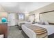 Bright bedroom features two beds, lamp, dresser, and view of the outside at 1105 S Ocean Blvd. # 1024, Myrtle Beach, SC 29572