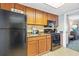 Well-maintained kitchen area with full-size appliances and wooden cabinets at 1105 S Ocean Blvd. # 1024, Myrtle Beach, SC 29572