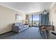 Cozy living room with comfortable seating and a balcony overlooking the ocean at 1105 S Ocean Blvd. # 1024, Myrtle Beach, SC 29572