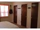 Bedroom with neutral walls, wood doors, guitar hanging on wall and window with orange curtains at 1145 Forest Dr., North Myrtle Beach, SC 29582