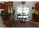 Inviting dining area with stylish light fixture, furniture and view to the outside at 1145 Forest Dr., North Myrtle Beach, SC 29582