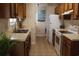 Traditional kitchen features wood cabinets, and white appliances at 1145 Forest Dr., North Myrtle Beach, SC 29582
