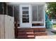 Charming screened porch with brick steps leads to outdoor relaxation and entertaining at 1145 Forest Dr., North Myrtle Beach, SC 29582