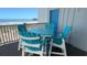 Charming balcony with seating overlooking the ocean and nearby pier at 126 N Waccamaw Dr. # 101, Garden City Beach, SC 29576