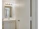 Simple bathroom with a single sink vanity and mirror at 126 N Waccamaw Dr. # 101, Garden City Beach, SC 29576