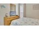 Comfortable bedroom with a queen-sized bed, dresser, and coastal-inspired decorations at 126 N Waccamaw Dr. # 101, Garden City Beach, SC 29576