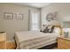 Cozy bedroom with nautical decor, side table, and comfortable queen bed at 126 N Waccamaw Dr. # 101, Garden City Beach, SC 29576