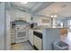 Well-equipped kitchen with appliances and breakfast bar for casual dining at 126 N Waccamaw Dr. # 101, Garden City Beach, SC 29576