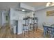 Kitchen with breakfast bar and adjacent dining area at 126 N Waccamaw Dr. # 101, Garden City Beach, SC 29576