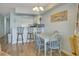 Bright kitchen and breakfast bar flow seamlessly into dining and living spaces at 126 N Waccamaw Dr. # 101, Garden City Beach, SC 29576