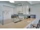 Functional kitchen with white appliances, ample counter space and cabinetry at 126 N Waccamaw Dr. # 101, Garden City Beach, SC 29576