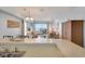 Open concept living area with access to balcony offering ocean views at 126 N Waccamaw Dr. # 101, Garden City Beach, SC 29576