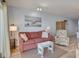 Relaxing living room featuring a comfortable sofa, accent chair, and beach-themed decor at 126 N Waccamaw Dr. # 101, Garden City Beach, SC 29576
