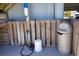 Enclosed outdoor shower area with trash can and cleaning station at 126 N Waccamaw Dr. # 101, Garden City Beach, SC 29576