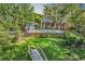 Beautiful backyard with a swimming pool, pool house, and lush green lawn at 130 Hagar Brown Rd., Murrells Inlet, SC 29576
