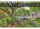 Backyard featuring southern oak trees, a tranquil water feature, and a private pool at 130 Hagar Brown Rd., Murrells Inlet, SC 29576