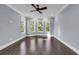 Bright bedroom showcasing a large bay window with views of the surrounding greenery at 130 Hagar Brown Rd., Murrells Inlet, SC 29576