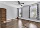 Spacious bedroom has hardwood floors, neutral walls, and windows with decorative curtains at 130 Hagar Brown Rd., Murrells Inlet, SC 29576