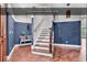Entryway with wood floors, staircase, vintage wash sink, and access to outside at 130 Hagar Brown Rd., Murrells Inlet, SC 29576