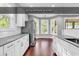 Modern kitchen featuring stainless steel appliances, bright windows, and granite countertops at 130 Hagar Brown Rd., Murrells Inlet, SC 29576